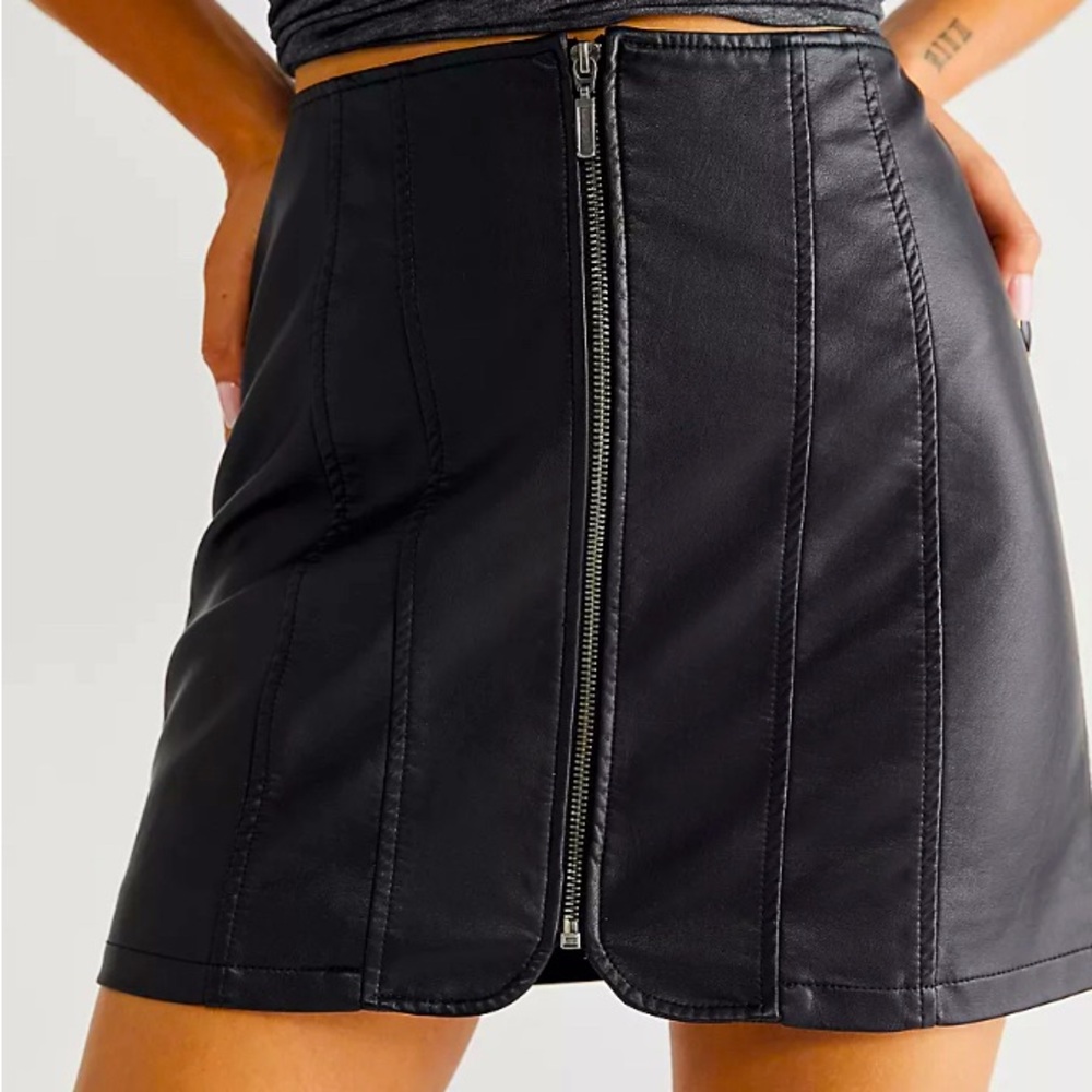 Free People black zip-front mini-skirt in machine washable pleather.